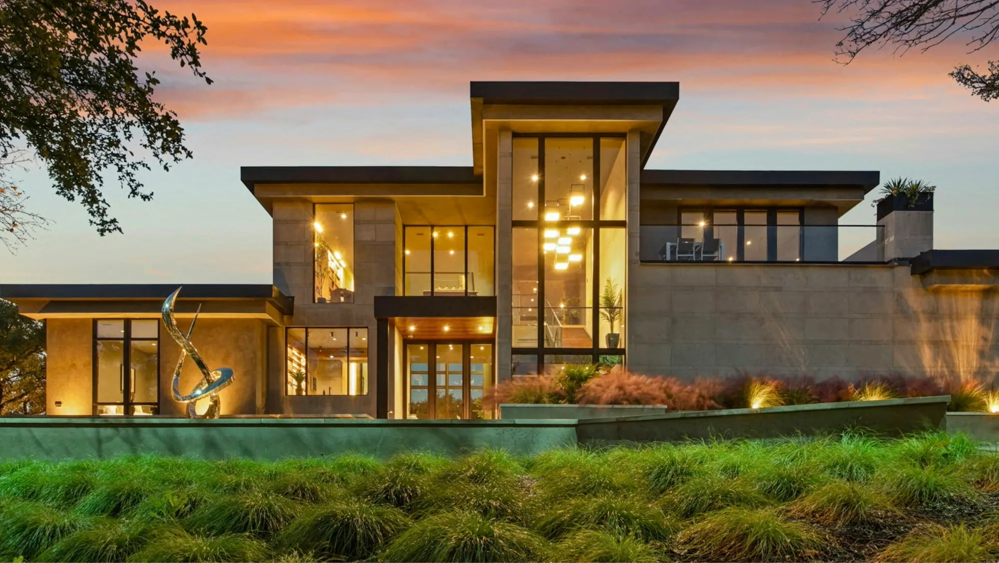 A Texas home at dusk under a roof restored after storm damage